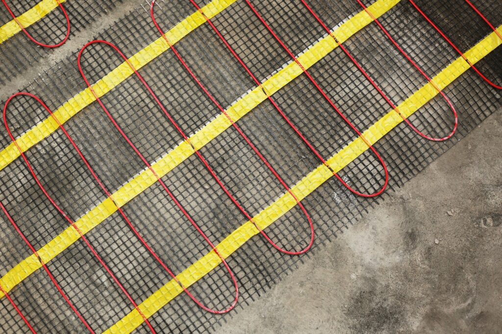 Installation of underfloor heating for thermal comfort using conduction radiation and convection.